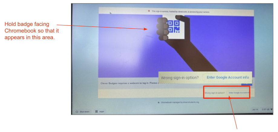 Student holding a Clever badge up to Chromebook camera to login.